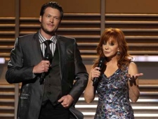 In this April 3, 2011, file photo, Blake Shelton and Reba McEntire host the 46th Annual Academy of Country Music Awards in Las Vegas. (AP Photo/Julie Jacobson, file)