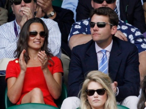 Pippa Middleton, sister of the Duchess of Cambridge, watches the All England Lawn Tennis Championships, along with Alex Loudon, at Wimbledon on Wednesday, June 29, 2011. (AP Photo/Alastair Grant)
