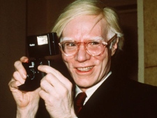 This 1976 file photo shows pop artist Andy Warhol in New York. Legendary rock band The Velvet Underground is suing the Andy Warhol Foundation over the banana design created by Warhol and used by group on its first album cover. The lawsuit filed Wednesday, Jan. 11, 2012 in federal court in Manhattan says the foundation slipped up when it licensed the design for use on iPhone and iPad products. (AP Photo/Richard Drew)