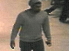 A man wanted in a voyeurism investigation at York University is shown in a surveillance camera image. 