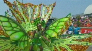 A parader marches in the Caribbean Carnival Grand Parade in Toronto on Saturday, August 2, 2014.


