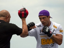 Vitor Belfort, of Brazil, right, trains during UFC Rio Open Workouts on Barra de Tijuca Beach in Rio de Janeiro, Brazil, Wednesday Jan. 11, 2012. Belfort will face Anthony Johnson, of the U.S., on Jan. 14 at the Ultimate Fighting Championship's UFC 142, the organization's second event in Rio de Janeiro. (AP Photo/Felipe Dana)