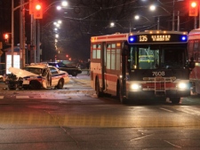 A female officer was injured when her police cruiser crashed into the side of a TTC bus at Danforth Avenue and Main Street early Friday, Jan. 13, 2012. (CP24/Tom Stefanac)