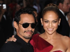 In this June 7, 2011 photo, Marc Anthony and Jennifer Lopez attend the Samsung Hope for Children Gala in New York. The stars, who announced last summer they were ending their marriage after seven years, appeared on a stage Saturday, Jan. 14, 2012, to talk briefly about a new music series they are doing together. "Q'Viva! The Chosen" premieres on Univision on Jan. 28. Anthony reached down to offer his hand and help Lopez climb three stairs to the stage, and later admired the four sparkling rings on her left hand. They sat side by side on director's chairs. (AP Photo/Peter Kramer)