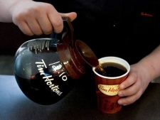 A cup of Tim Hortons coffee is poured in Toronto on May 14, 2010. (THE CANADIAN PRESS/Chris Young)