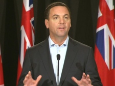 Ontario PC leader Tim Hudak speaks to reporters in this Friday, Oct. 7, 2011, file photo.