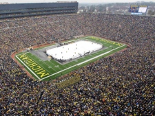 More than 100,000 fans watched a NCAA college hockey game between Michigan and Michigan State at Michigan Stadium in Ann Arbor, Mich., Saturday, Dec. 11. 2010. (AP Photo/Carlos Osorio)