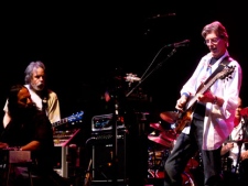 In this Feb. 4, 2008 file photo, Phil Lesh, right, performs during a fundraising concert in San Francisco while Grateful Dead band mate Bob Weir, standing at left, looks on. (AP Photo/Noah Berger)