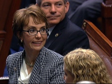 This video image provided by House Television shows Rep. Gabrielle Giffords on the floor of the House on Capitol Hill in Washington, Wednesday, Jan. 25, 2012. Giffords resigned from the House amid tears, tributes and standing ovations, more than a year after she was gravely wounded by a would-be assassin. (AP Photo/House Television)