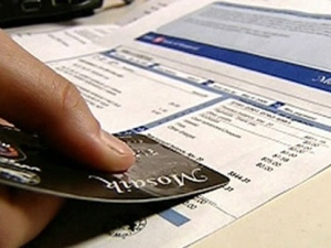 A credit card and statement are pictured in this file photo.