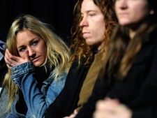Snowboard superpipe competitor Gretchen Bleiler wipes a tear from her eye as she remembers Sarah Burke, the Canadian freestyle skier who died less than a week ago, during the opening Winter X Games news conference on Wednesday, Jan. 25, 2012, in Aspen, Colo. (AP Photo/The Denver Post, AAron Ontiveroz)