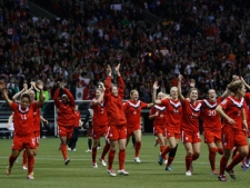 Canada celebrates it's 3-1 win over Mexico following CONCACAF women's Olympic qualifying soccer action at B.C. Place in Vancouver, B.C., Friday, Jan. 27, 2012. THE CANADIAN PRESS/Jonathan Hayward