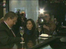 Officials with the Trump Tower in Toronto enjoy cocktails on the luxury hotel's opening day on Jan. 31, 2012.