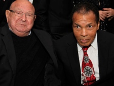 Muhammad Ali, right, celebrates his 70th birthday next to his longtime trainer Angelo Dundee, at a fundraiser for the Muhammad Ali Center in Louisville, Ky., on Saturday, Jan. 14, 2012. (AP Photo/ The Muhammad Ali Center)