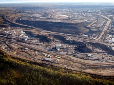 This Sept. 19, 2011 aerial photo shows a tar sands mine facility near Fort McMurray, in Alberta, Canada. (AP Photo/The Canadian Press, Jeff McIntosh)