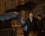 Actor Bill Murray is soaked by a down pour of rain as he greets fans for his new movie " St. Vincent" during the 2014 Toronto International Film Festival in Toronto on Friday, September 5, 2014. THE CANADIAN PRESS/Nathan Denette