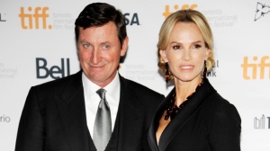 Janet Jones Gretzky, a cast member in "The Sound and the Fury," poses with her husband, pro hockey great Wayne Gretzky, at the premiere of the film at Ryerson Theatre during the Toronto International Film Festival on Saturday, Sept. 6, 2014, in Toronto. (Photo by Chris Pizzello/Invision/AP)