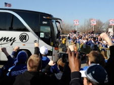 Fans cheer as the New York Giants arrive back at the Giants NFL football training facility on Monday, Feb. 6, 2012, in East Rutherford, N.J. A day earlier, the Giants defeated the New England Patriots in Super Bowl XLVI. (AP Photo/Bill Kostroun) 