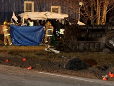 Ontario Provincial Police and emergency crews investigate a multiple fatal motor vehicle accident near Hampstead, Ontario, Monday, February 6, 2012.  Police say 11 people died in the crash.  THE CANADIAN PRESS/Dave Chidley