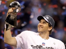 New York Giants quarterback Eli Manning celebrates with the Vince Lombardi Trophy after the Giants' 21-17 win over the New England Patriots in NFL Super Bowl XLVI on Sunday, Feb. 5, 2012, in Indianapolis. (AP Photo/Chris O'Meara)