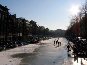 People skate on the frozen Keizersgracht canal in Amsterdam, Netherlands, Tuesday Feb. 7, 2012. (AP Photo/Margriet Faber)