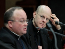 Monsignor Stephen Rossetti (right), a psychologist who for a decade ran a U.S. treatment centre for abusive priests, listens to Monsignor Charles Scicluna during a press conference in Rome on Wednesday, Feb. 8, 2012. (AP Photo/Gregorio Borgia)