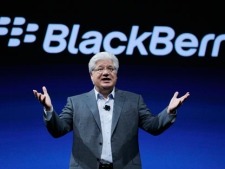 In this Oct. 18, 2011 file photo, Mike Lazaridis, co-CEO of Research in Motion gestures at the end of his keynote address to the BlackBerry DevCon Americas conference in San Francisco. (AP Photo/Eric Risberg)