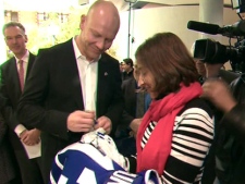 Former Toronto Maple Leafs captain Mats Sundin signs a jersey for a fan at the University of Toronto on Friday, Feb. 10, 2012.