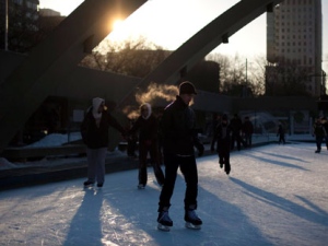 Skaters' breath is lit by the setting sun while skating on a cold afternoon in Toronto, Ont. Sunday, January 23, 2011. THE CANADIAN PRESS/Darren Calabrese