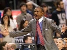 Toronto Raptors head coach Dwane Casey gestures to official Scott Foster after Foster called a five second violation when the Raptors failed to inbound the ball in the final seconds of the game as the Los Angeles Lakers defeated the Raptors in Toronto on Sunday, Feb. 12, 2012. (THE CANADIAN PRESS/Nathan Denette)