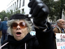 A pensioner shouts during a demonstration outside the Labor Ministry in Athens, as pensioners protested the Greek government's planned pension cut Tuesday, Feb. 14, 2012. (AP Photo/Thanassis Stavrakis)