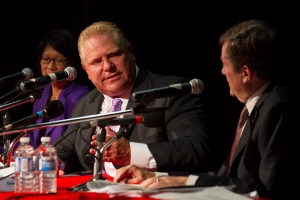 Doug Ford (centre) sits alongside John Tory (right) and Olivia Chow as he takes part in a mayoral debate in Toronto on Tuesday, Sept. 23, 2014. (The Canadian Press/Chris Young)