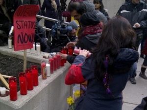 A group calling itself Justice for Migrant Workers held a demonstration in Toronto on Friday, Feb. 17, 2012, to call for inquests into a crash that killed 11 people near Hampstead, Ont., and a farm accident that killed two workers in 2010. (CP24/Katie Simpson)