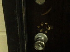 A shotgun was fired at an apartment door on the York University campus Saturday morning. The damage is shown above. (CTV)