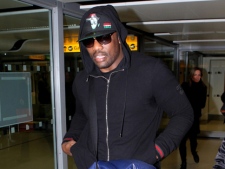 British boxer Dereck Chisora arrives at Heathrow Airport in London on Sunday, Feb. 19, 2012, following his WBC heavyweight title fight with Vitali Klitschko in Munich, Germany. Chisora was released after nearly seven hours of questioning by police following his brawl with former WBA champion David Haye at a post-fight news conference. (AP Photo/PA, Steve Parsons)