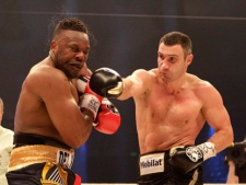 WBC heavyweight champion Vitali Klitschko, right, punches challenger Dereck Chisora during their WBC heavyweight title boxing bout at the Olympic Hall in Munich, Germany on Saturday, Feb. 18, 2012. (AP Photo/Frank Augstein)