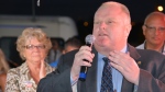Rob Ford speaks to a crowd of Ford Nation supporters in Etobicoke Saturday September 27, 2014 as his mother Diane Ford looks on. (Joshua Freeman/CP24)