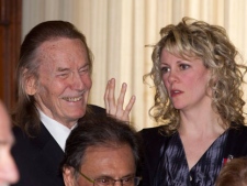 Gordon Lightfoot and Natalie MacMaster chat after being presenting him with the inaugural Queen Elizabeth II Diamond Jubilee medals in Toronto on Monday, Feb. 6, 2012. (THE CANADIAN PRESS/ Frank Gunn)