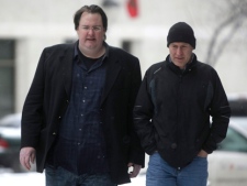 Greg Gilhooly, left, arrives at the Law Courts Building in Winnipeg on Wednesday, Feb. 22, 2012, prior to a sentencing hearing for former junior hockey coach Graham James. (THE CANADIAN PRESS/Trevor Hagan)