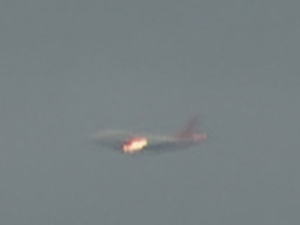 A Sunwing flight prepares for an emergency landing at Pearson International Airport. The plane appears to be on fire. 