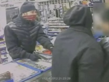 Two suspects in an armed robbery are shown in this surveillance camera image.