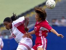 Canada's Charmaine Hooper (10) and China's Lirong Wen (12) vie for the ball during first half action during the consolation game at Women's Gold Cup soccer in Foxboro, Mass. Monday, July 3, 2000. (AP Photo/Elise Amendola)