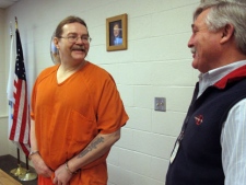 Ronald A. Smith, left, speaks with his attorney Greg Jackson on Wednesday, Feb. 22, 2012, discussing his request for executive clemency from the death penalty, at Deer Lodge, Mont. Smith, awaiting execution for killing two men in 1982, filed a clemency request Wednesday, Feb. 22, 2012 with the Montana Board of Pardons and Parole, arguing he is now a far different person than at the time of the offense. (AP Photo/Matt Gouras)