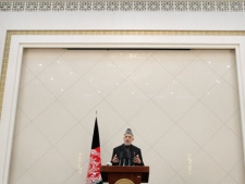 Afghan President Hamid Karzai speaks during a press conference at the presidential palace in Kabul, Afghanistan, Sunday, Feb. 26, 2012. Afghanistan's president renewed his calls for calm on Sunday in a televised address to the nation after the burning of Qurans at a U.S. base sparked five days of deadly protests and prompted the international military coalition to pull its advisers from Afghan ministries out of fear that they would become the next targets. (AP Photo/Musadeq Sadeq)