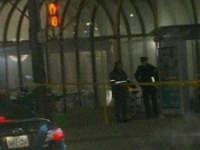 Police are seen outside Dupont Station Sunday night. (CP24)