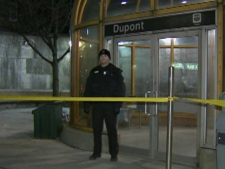 A Toronto police officer stands outside Dupont Station after a TTC fare collector was shot during an attempted robbery Sunday, Feb. 27, 2012.