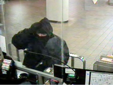 One of four photos that depicts a suspect robbing TTC collectors on various dates. Police believe this suspect is responsible for shooting a TTC staffer at Dupont Station on Feb. 26, 2012.