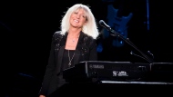 Christine McVie from the band Fleetwood Mac performs at Madison Square Garden on Monday, Oct. 6, 2014, in New York. (Photo by Charles Sykes/Invision/AP)