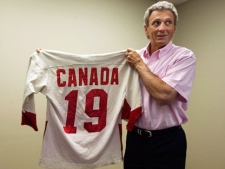 Canadian hockey legend Paul Henderson holds his original 1972 Canada jersey in his office in Mississauga, Ont., on June 7, 2010. Once again, Henderson is credited with making hockey history. A Montreal-based auction house says it's received a certificate from the Guinness World Records about the jersey Henderson was wearing when he scored the winning goal in the 1972 Summit Series against the Soviets. The shirt sold for $1.275 million, the most expensive hockey jersey ever sold at auction. THE CANADIAN PRESS/Nathan Denette