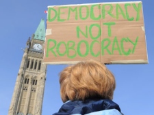 Protesters take part in a robocall protest on Parliament Hills in Ottawa on Monday, March 5, 2012. (THE CANADIAN PRESS/Sean Kilpatrick)